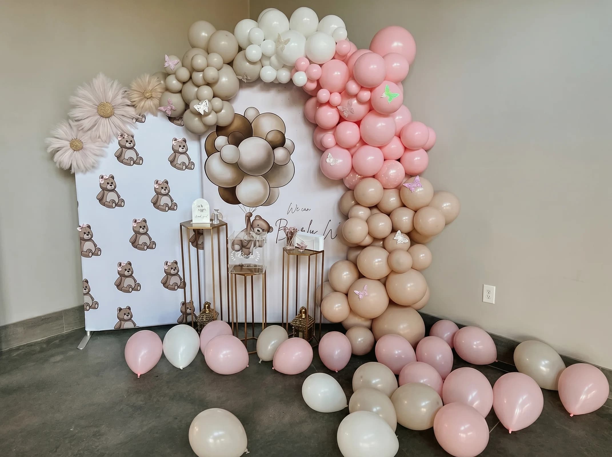 Baby shower backdrop with a pink and beige balloon garland at Fellowship Event Hall in Dacula, Georgia